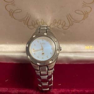 Fossil watch with iridescent face.